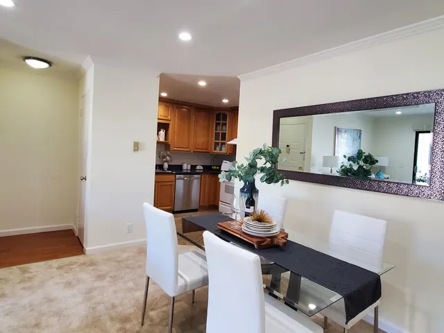 a kitchen with a table and chairs in it