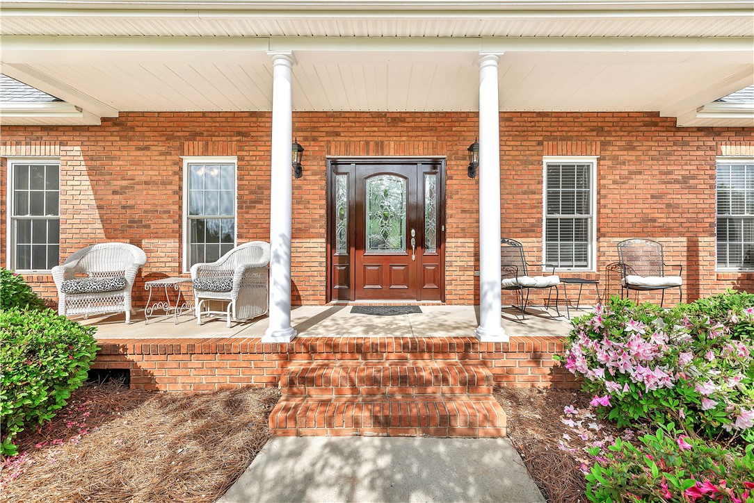 3108 Cobbs Way Anderson, SC 29621 - Photo 41 of 44 This inviting porch welcomes you home, showcasing classic brick construction and graceful columns.