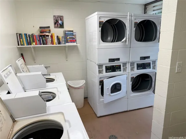 a utility room with dryer washer and other items