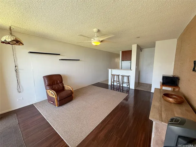 a bedroom with furniture and wooden floor