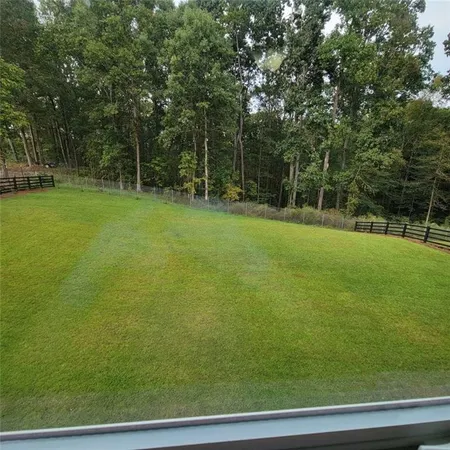 a view of a field with a trees