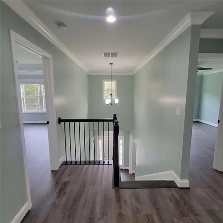 wooden floor in an empty room with a mirror