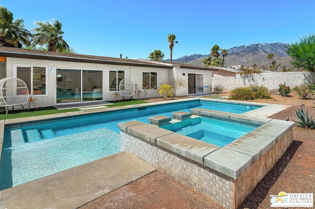 2864 East Valencia Road Palm Springs, CA 92262 - Photo 15 of 31 a view of a house with swimming pool and a porch