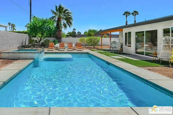 a view of a house with swimming pool