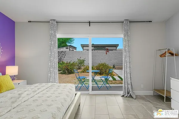 a bedroom with a bed and a table