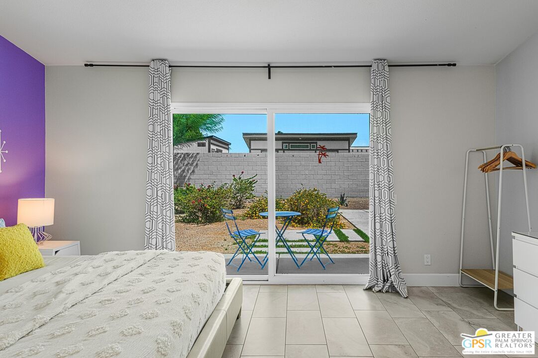 2864 East Valencia Road Palm Springs, CA 92262 - Photo 21 of 31 a bedroom with a bed and a table