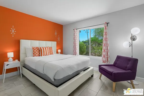 a bed room with a bed and a couch