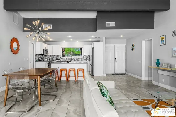 a view of a kitchen and dining room