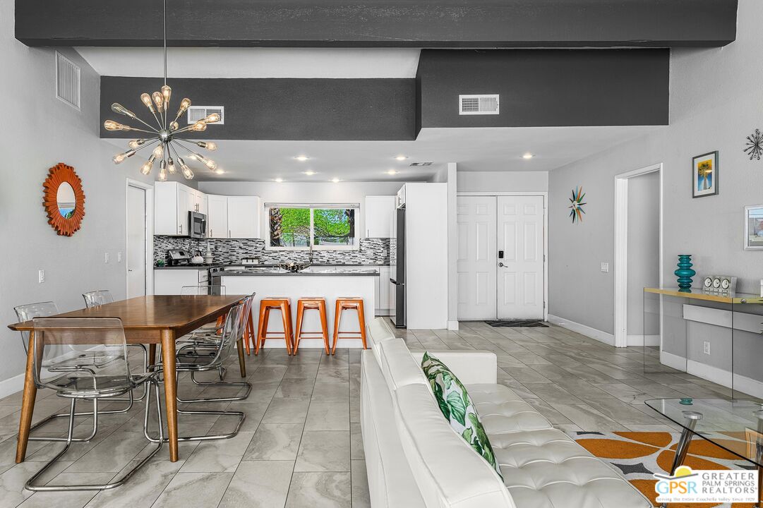 2864 East Valencia Road Palm Springs, CA 92262 - Photo 4 of 31 a view of a kitchen and dining room