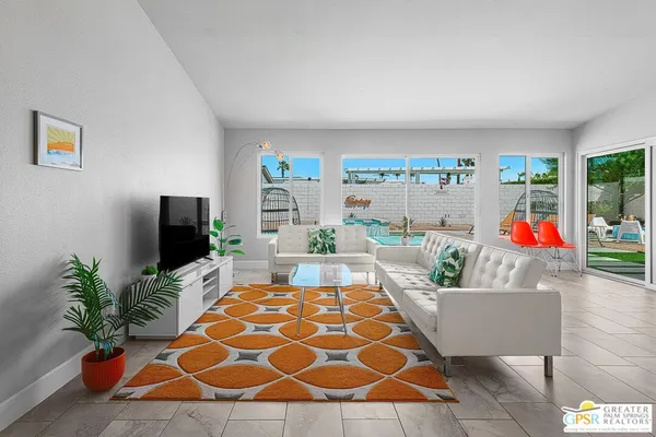 a living room with a couch and a flat screen tv