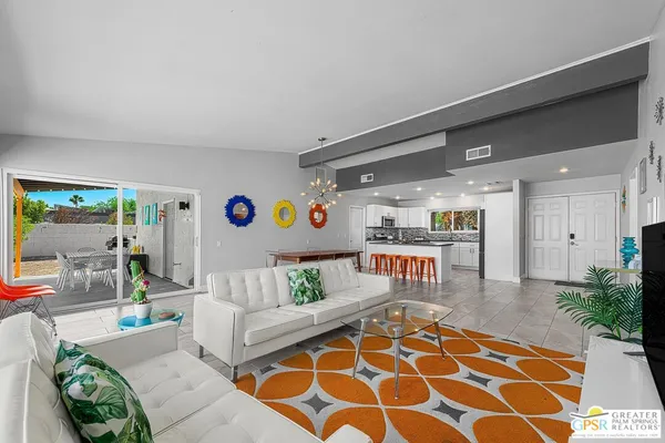 a living room with furniture and a rug