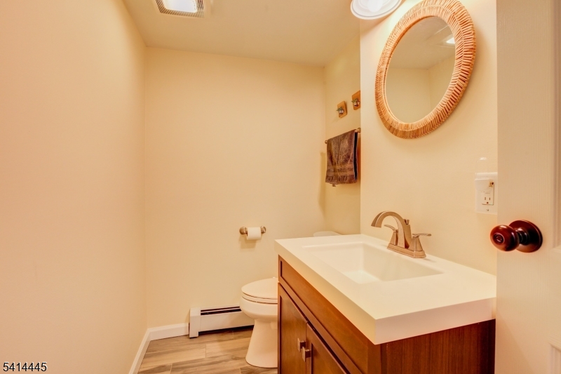 46 Walnut Street Pompton Lakes, NJ 07442 - Photo 15 of 22 a bathroom with a sink and a mirror