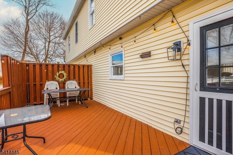 46 Walnut Street Pompton Lakes, NJ 07442 - Photo 20 of 22 a backyard of a house with table and chairs