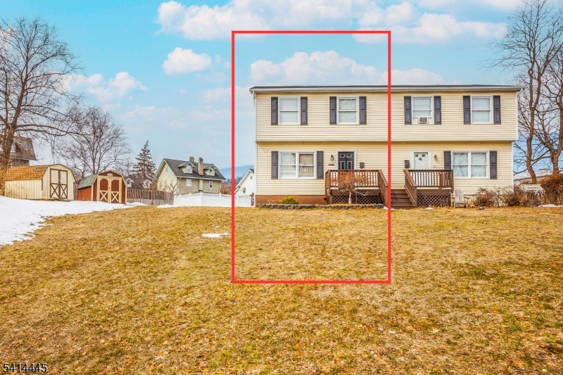 46 Walnut Street Pompton Lakes, NJ 07442 - Photo 4 of 22 a front view of a house with a yard