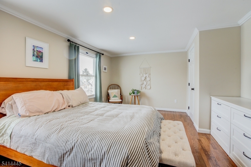 46 Walnut Street Pompton Lakes, NJ 07442 - Photo 10 of 22 a bedroom with a bed and a large window