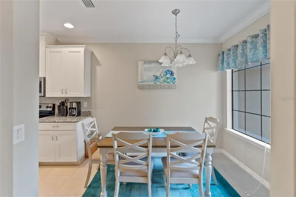 a dining room with furniture and window