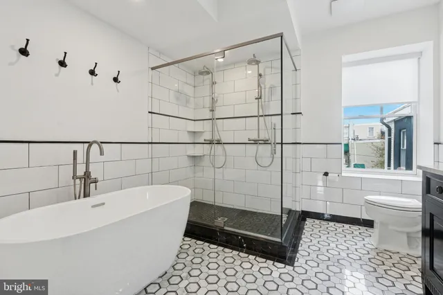 a bathroom with a bathtub and a shower