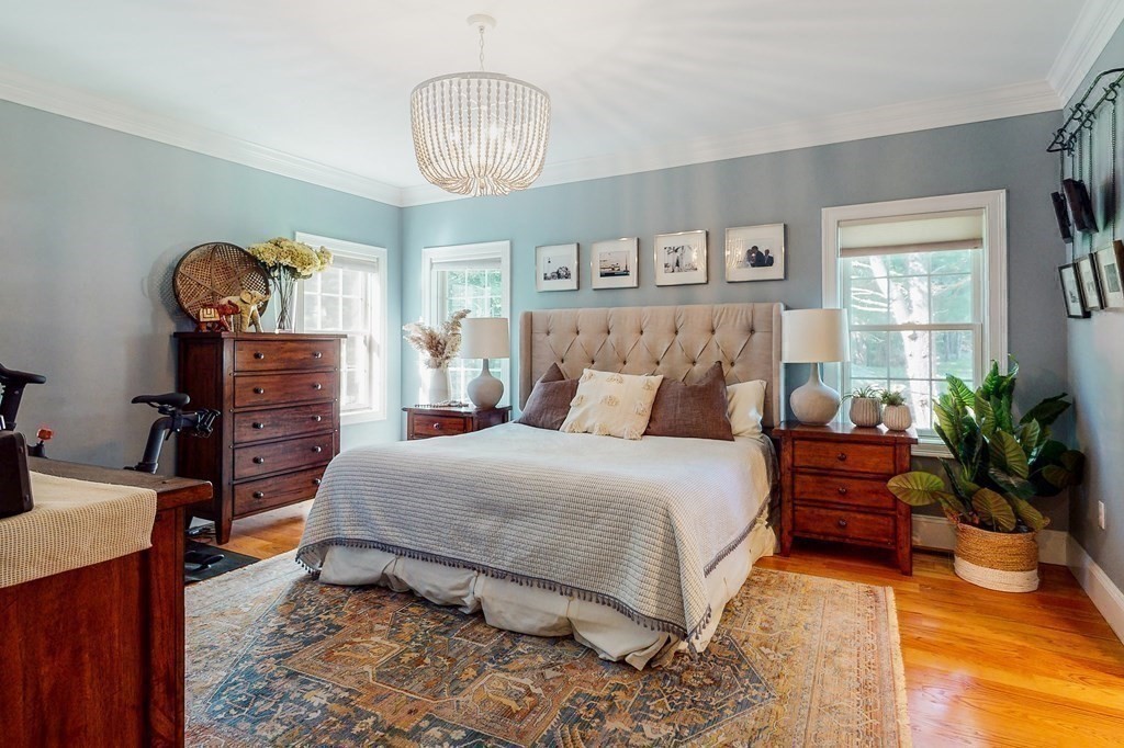 185 Bailey Street Canton, MA 02021 - Photo 11 of 32 a bedroom with a bed and wooden floor