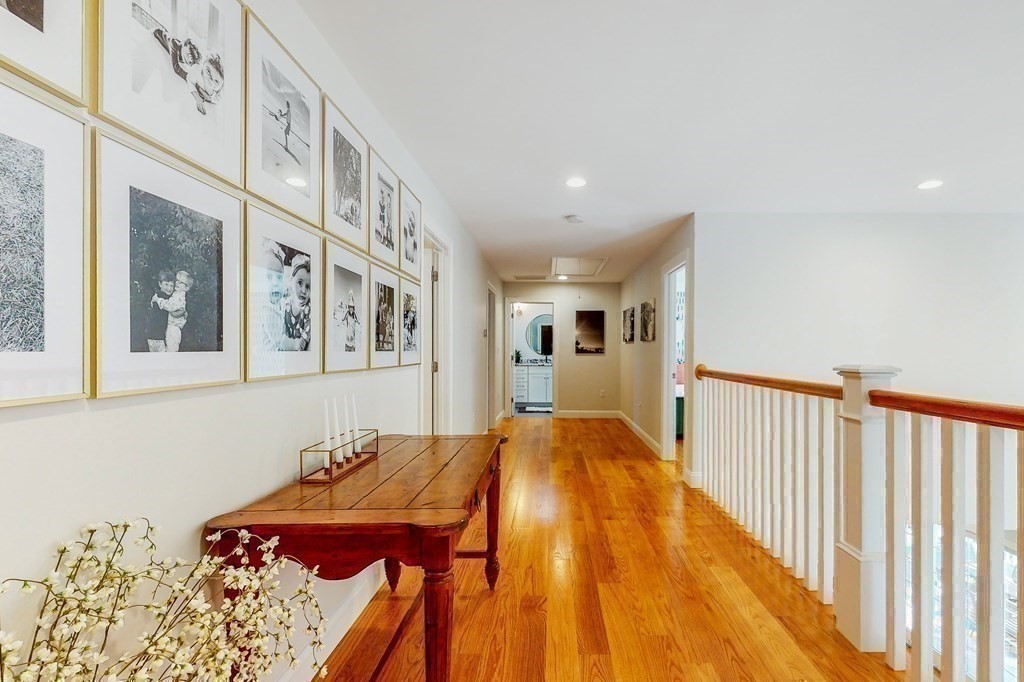 185 Bailey Street Canton, MA 02021 - Photo 16 of 32 a bed room with a bed and a painting on the wall