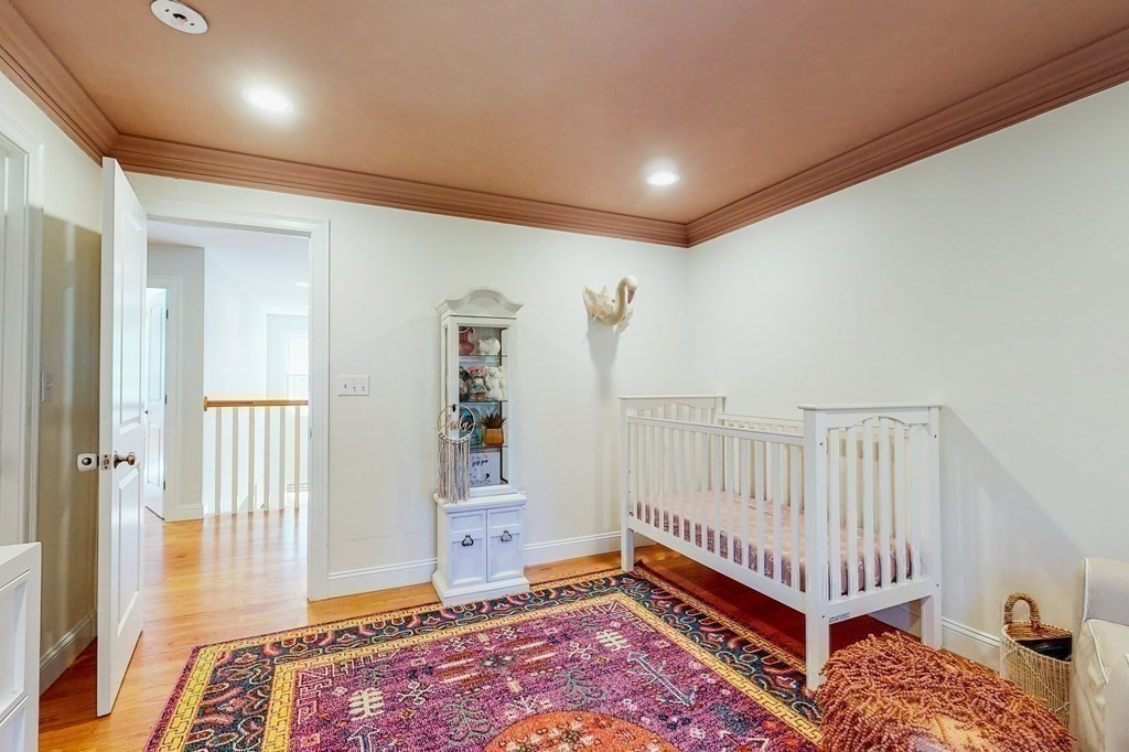 185 Bailey Street Canton, MA 02021 - Photo 17 of 32 a room with furniture and wooden floor