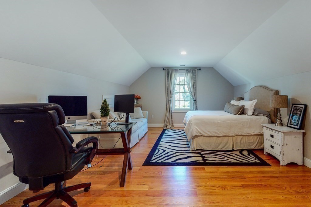 185 Bailey Street Canton, MA 02021 - Photo 20 of 32 a bedroom with a bed and wooden floor