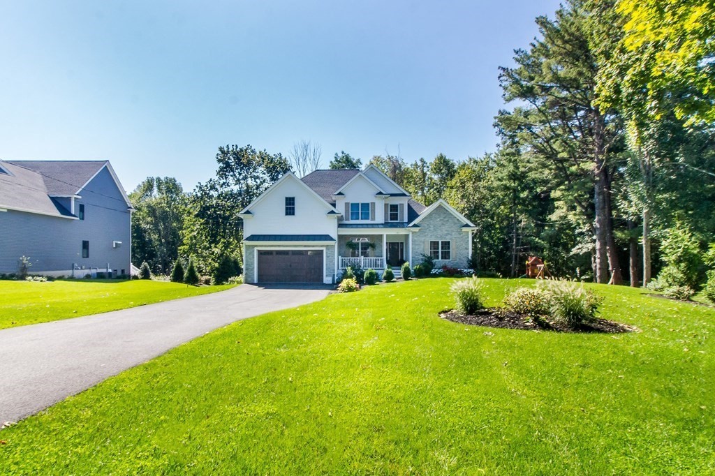 185 Bailey Street Canton, MA 02021 - Photo 2 of 32 a front view of a house with a yard