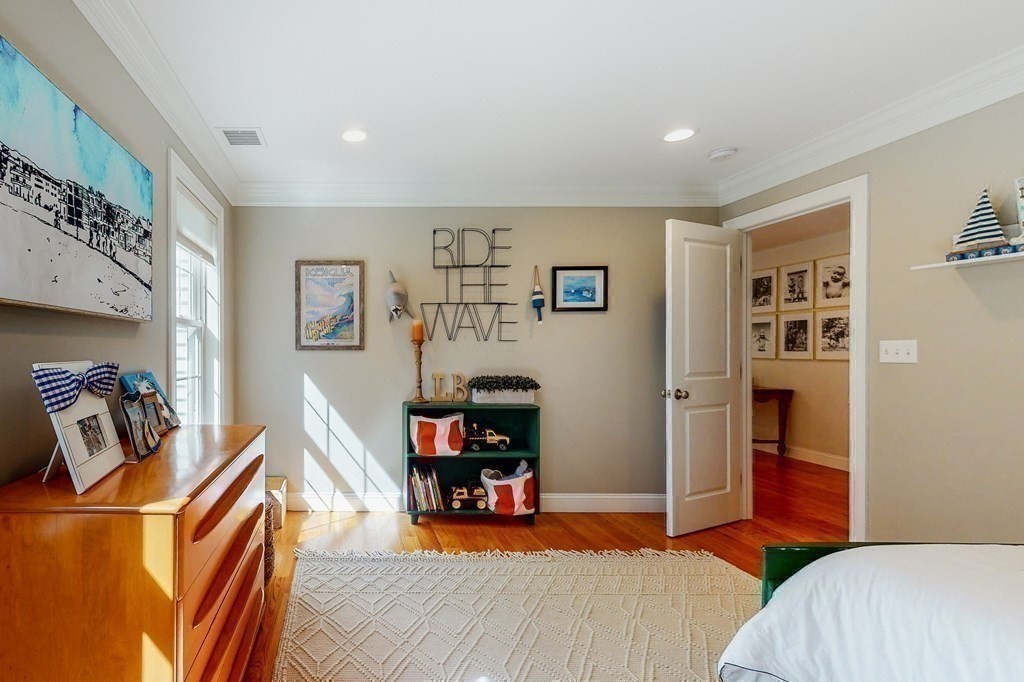 185 Bailey Street Canton, MA 02021 - Photo 21 of 32 a bedroom with furniture and a wooden floor