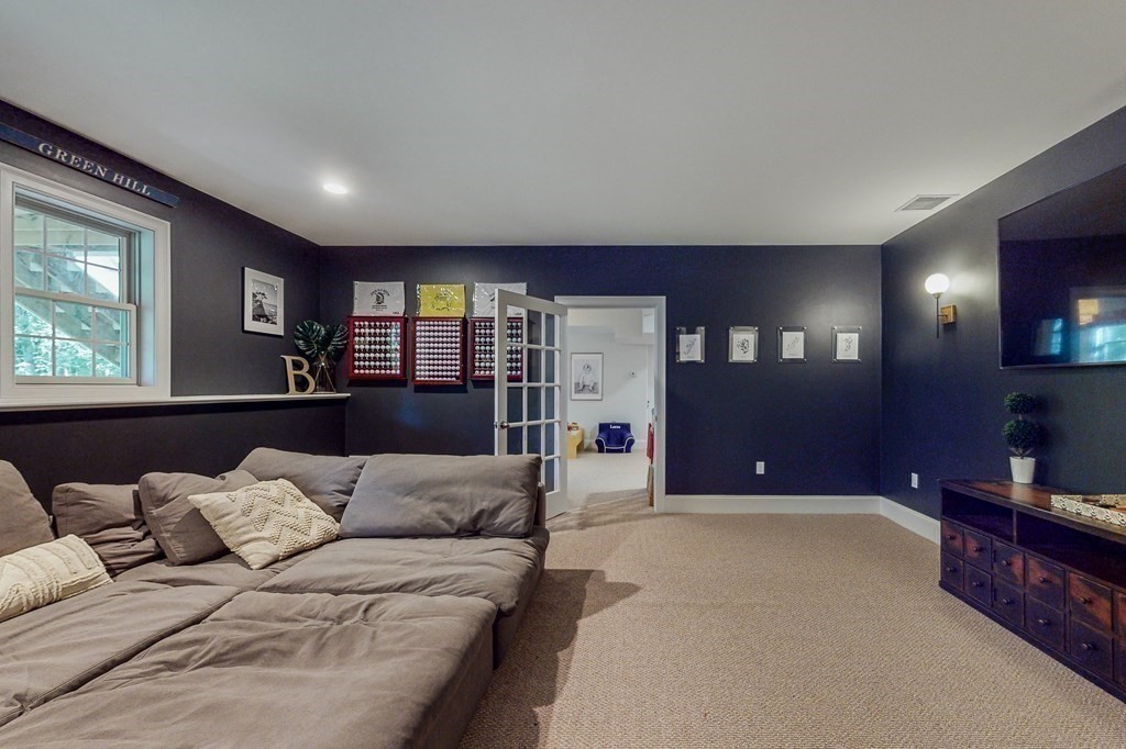 185 Bailey Street Canton, MA 02021 - Photo 27 of 32 a living room with furniture and a flat screen tv