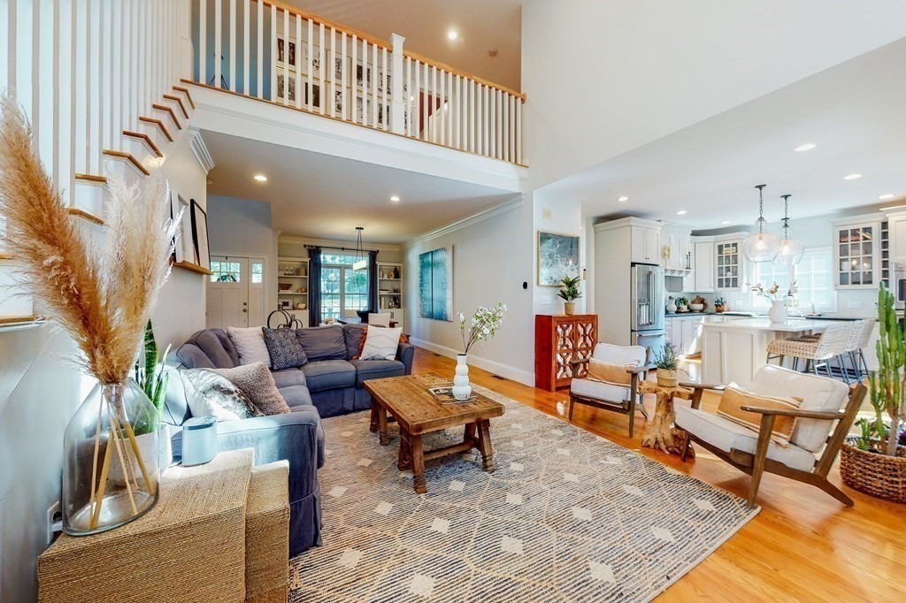 185 Bailey Street Canton, MA 02021 - Photo 3 of 32 a living room with furniture and a rug