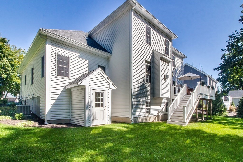 185 Bailey Street Canton, MA 02021 - Photo 31 of 32 a view of a house with a yard