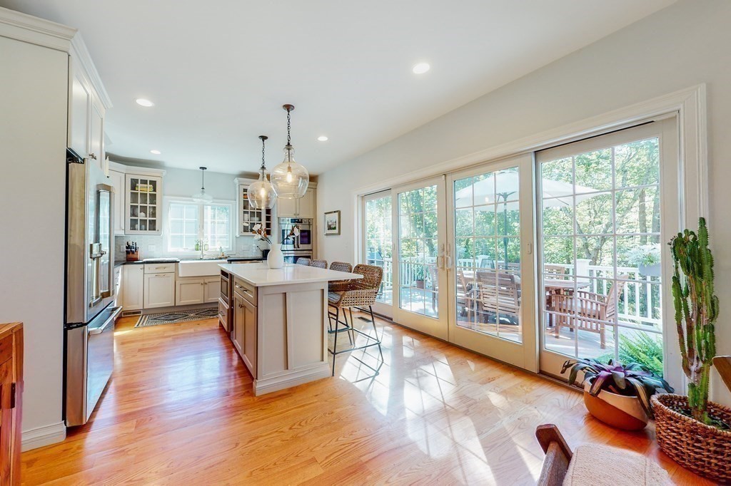 185 Bailey Street Canton, MA 02021 - Photo 5 of 32 a view of a living room and kitchen floor to ceiling window and kitchen view
