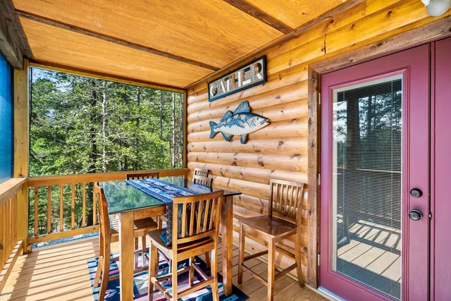 a view of a patio with a table and chairs
