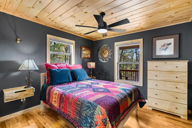 a view of a backyard with table and chairs