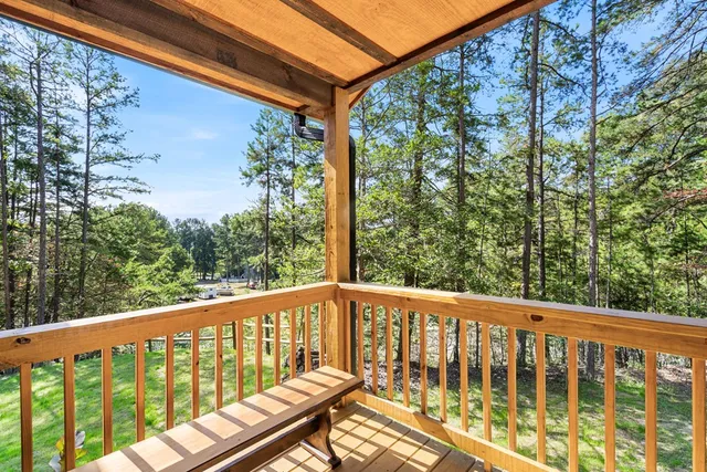 a view of a balcony with wooden floor