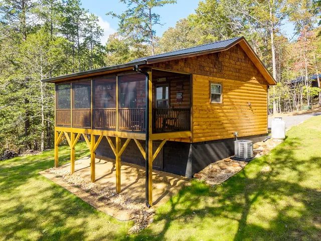 a view of an house with backyard space and balcony