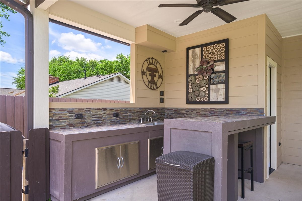 1502 Reimer Street Brenham, TX 77833 - Photo 26 of 30 a kitchen with a stove and a microwave