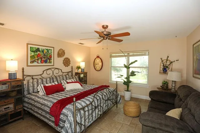 a bedroom with a bed and window