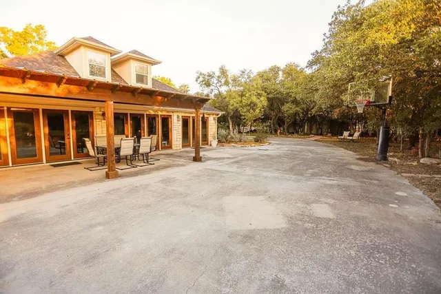 a view of a building with a backyard
