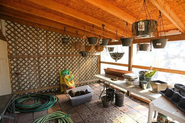 a table and chairs sitting in front of a house