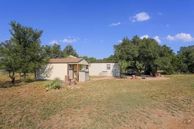 a house view with a backyard space