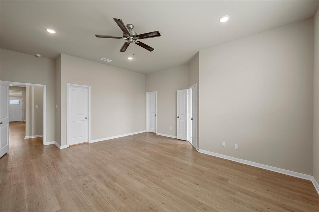 3205 Dottavio Road Lorena, TX 76655 - Photo 16 of 33 Expansive room featuring wood-finish flooring, neutral-toned walls, a ceiling fan, and recessed lighting