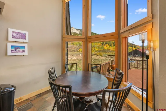 a view of a dining room with furniture window and wooden floor