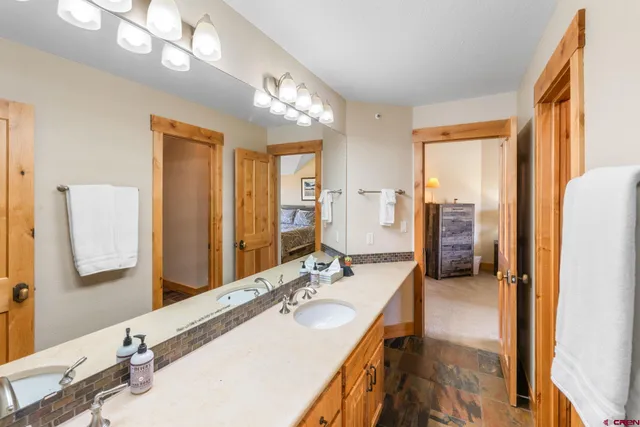 a bathroom with a sink double vanity and a mirror