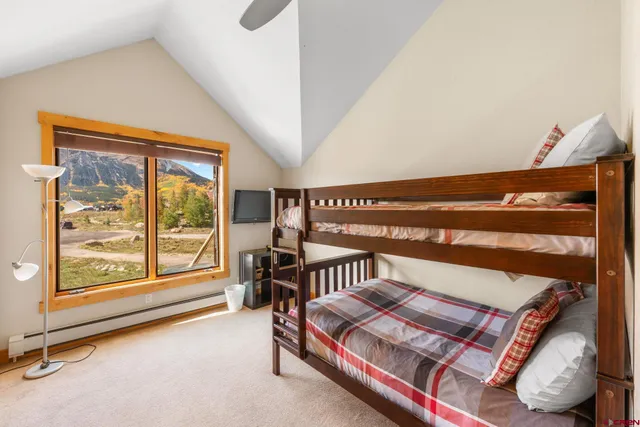 a bedroom with furniture and a window