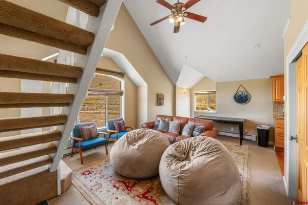 a living room with furniture and a window