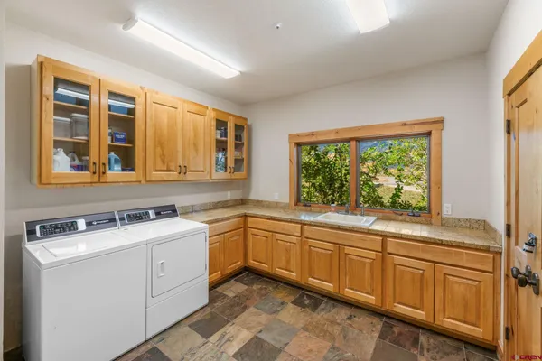 a kitchen that has a sink and a stove in it
