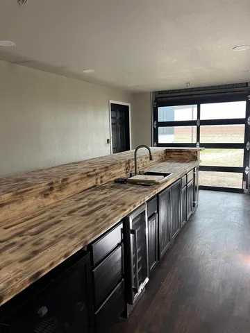 a kitchen with stainless steel appliances granite countertop a stove and a sink