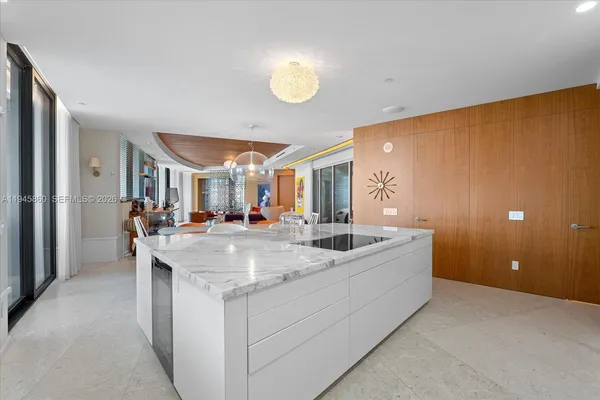 a view of a livingroom with furniture a flat screen tv and a couch
