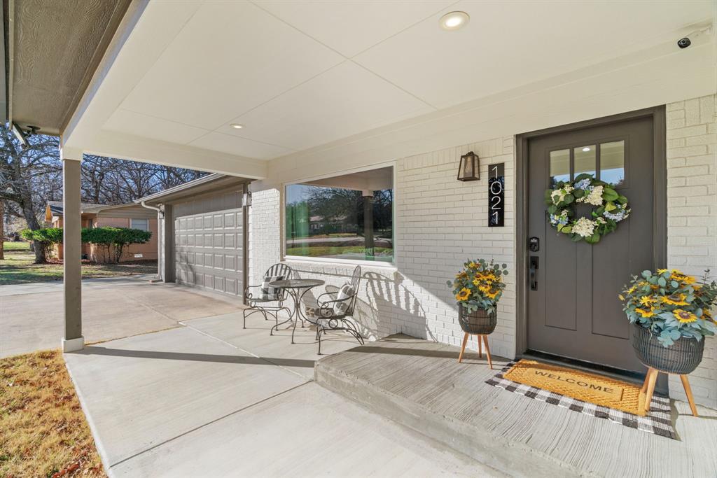 1021 Poe Street Azle, TX 76020 - Photo 1 of 38 a front view of a house with outdoor seating