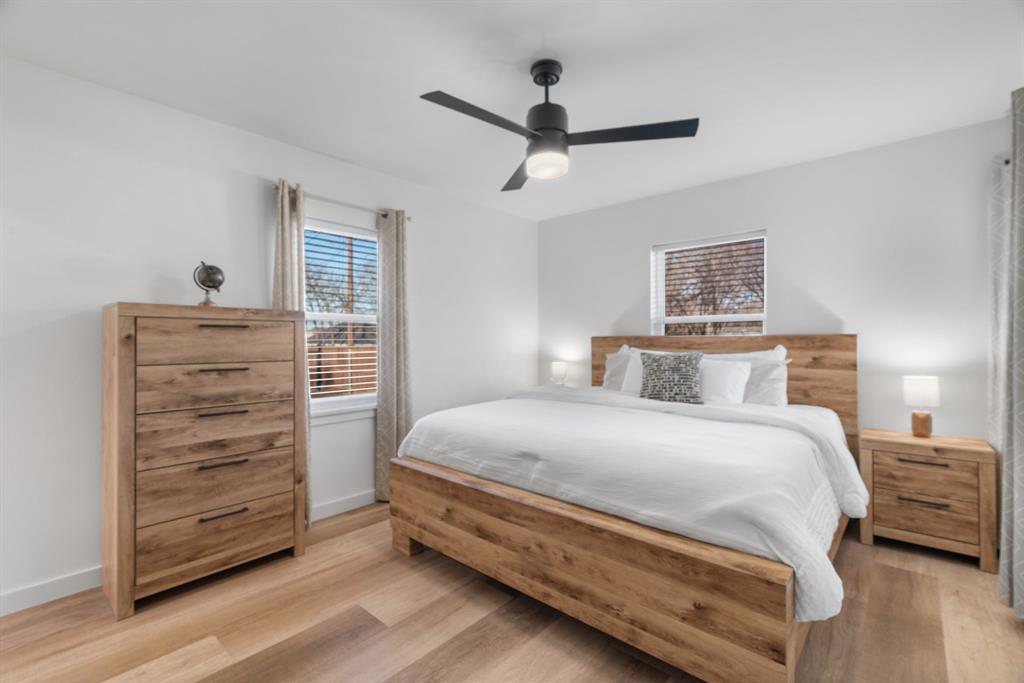 1021 Poe Street Azle, TX 76020 - Photo 25 of 38 a bedroom with a bed and a dresser